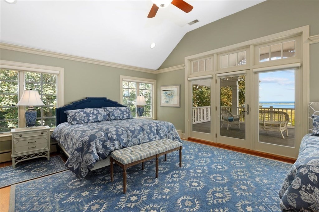 500 Shore Road Chatham, MA 02633 - Photo 16 of 32 a bedroom with a bed and glass door