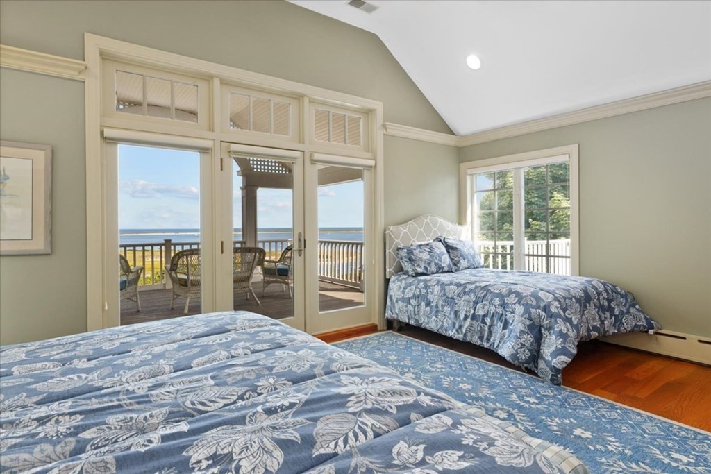 500 Shore Road Chatham, MA 02633 - Photo 17 of 32 a bedroom with a large bed and a window