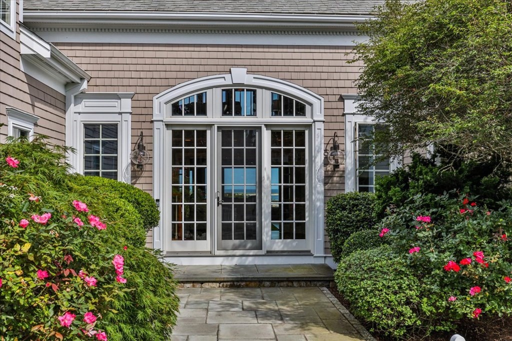 500 Shore Road Chatham, MA 02633 - Photo 2 of 32 a front view of a house with a porch
