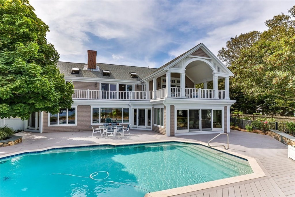 500 Shore Road Chatham, MA 02633 - Photo 22 of 32 a front view of a house with swimming pool having outdoor seating