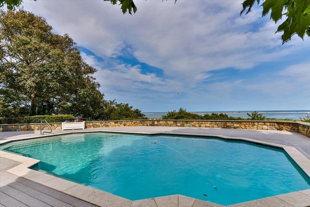 500 Shore Road Chatham, MA 02633 - Photo 26 of 32 a view of a swimming pool and an outdoor seating