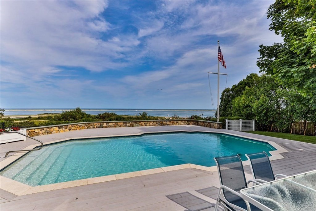 500 Shore Road Chatham, MA 02633 - Photo 27 of 32 a view of a swimming pool and a yard