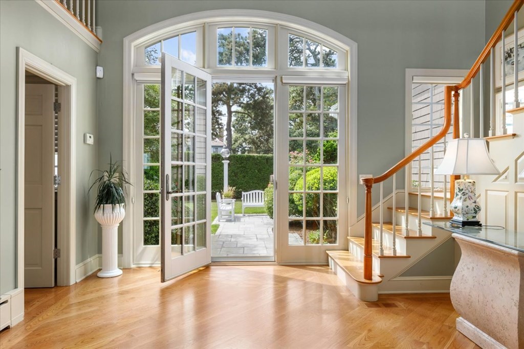 500 Shore Road Chatham, MA 02633 - Photo 3 of 32 a view of an entryway with wooden floor and windows