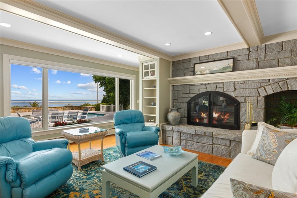 500 Shore Road Chatham, MA 02633 - Photo 4 of 32 a living room with furniture a fireplace and a flat screen tv
