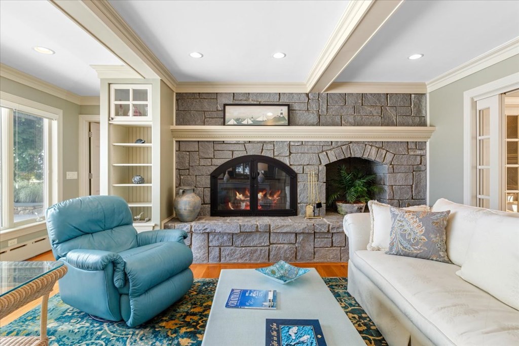 500 Shore Road Chatham, MA 02633 - Photo 6 of 32 a living room with furniture and a fireplace