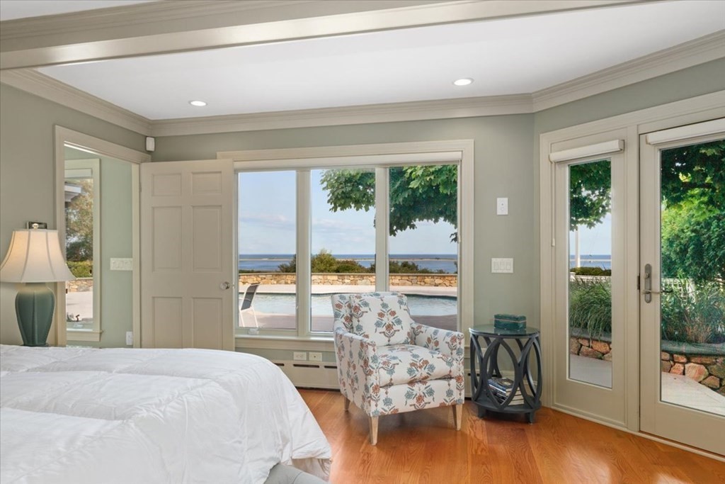 500 Shore Road Chatham, MA 02633 - Photo 10 of 32 a bedroom with furniture and large windows