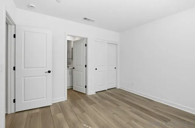 a view of entryway with wooden floor