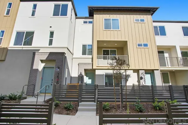 a view of a brick building with many windows