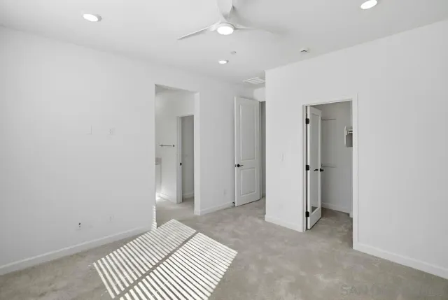 an empty room with closet area