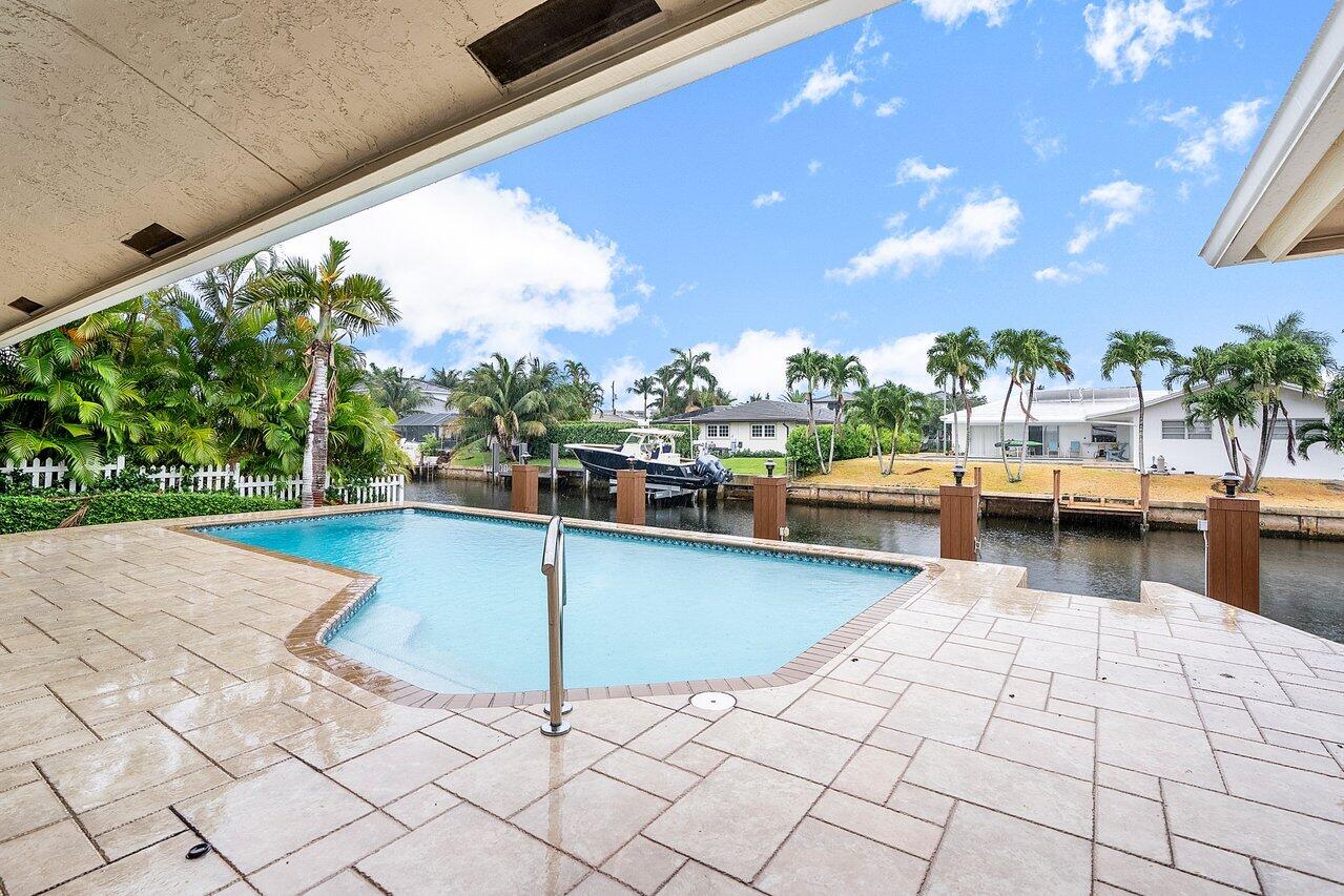 756 Dover Street Boca Raton, FL 33487 - Photo 2 of 29 Canal with seawall, dock, and boat lift