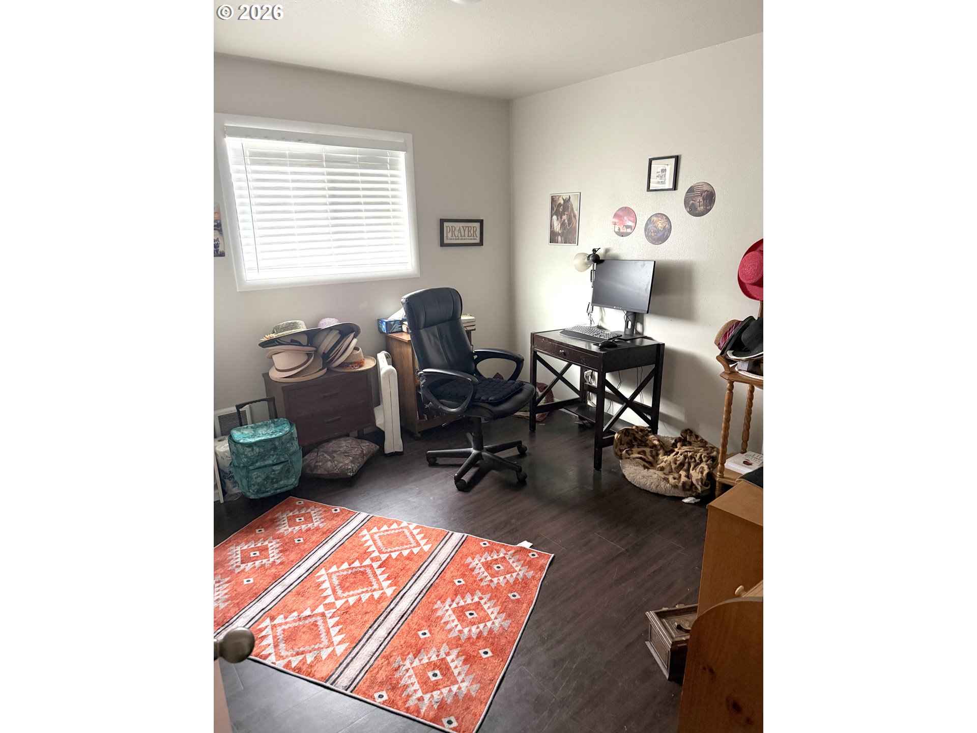 2735-2745 Myrtle Street Baker City, OR 97814 - Photo 12 of 27 a living room with furniture and a wooden floor