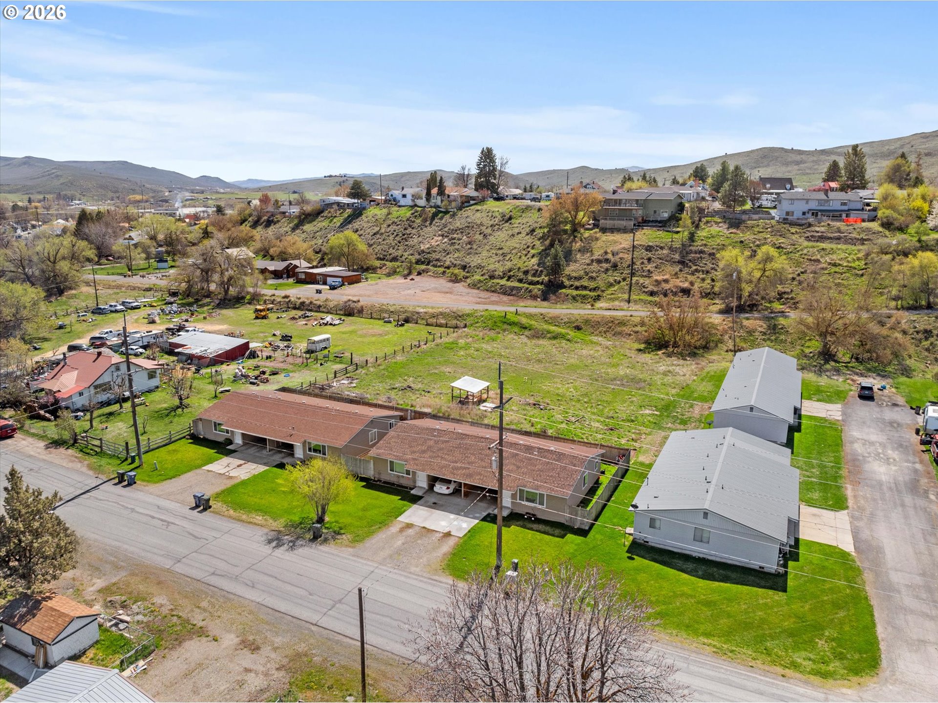2735-2745 Myrtle Street Baker City, OR 97814 - Photo 13 of 27 an aerial view of a house with a garden and lake view