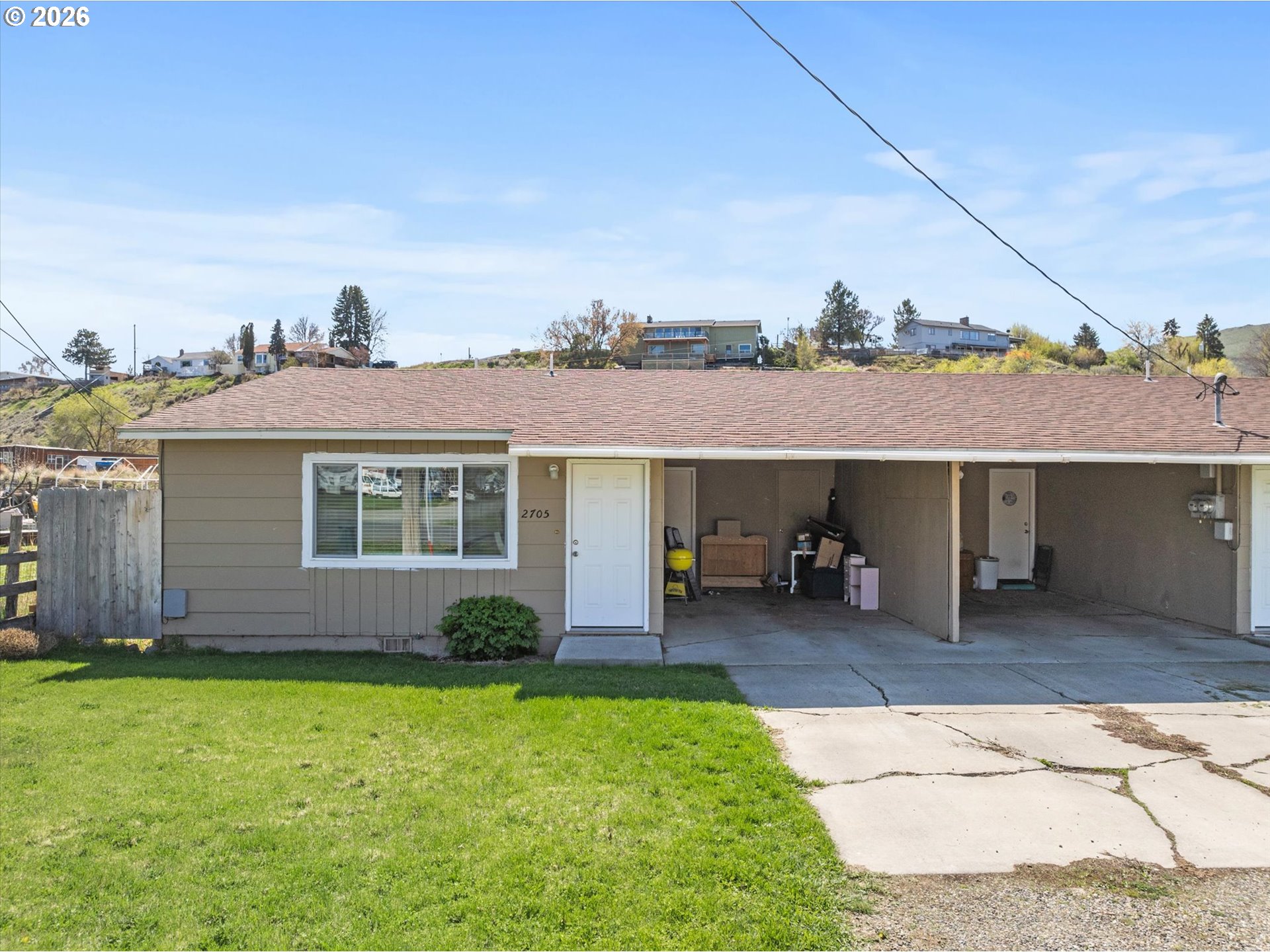 2735-2745 Myrtle Street Baker City, OR 97814 - Photo 26 of 27 a view of a house with a patio and a yard