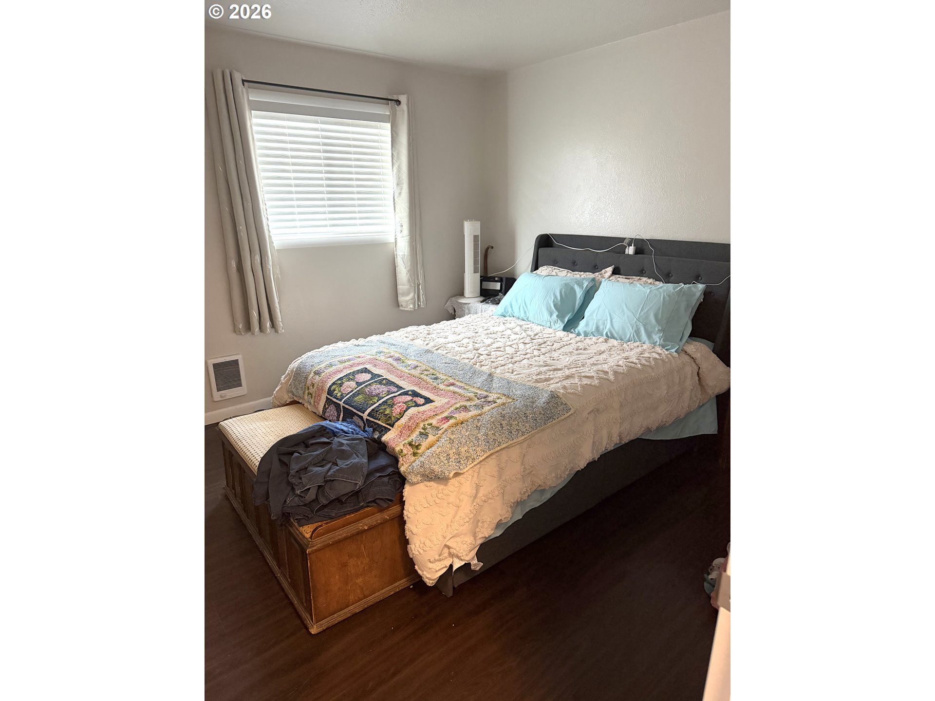 2735-2745 Myrtle Street Baker City, OR 97814 - Photo 7 of 27 a bedroom with a bed and wooden floor