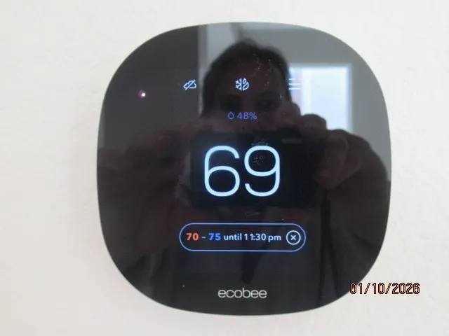 a view of living room with furniture and entryway