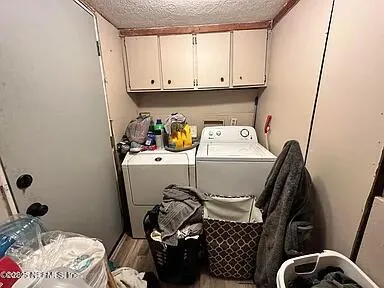 a view of a livingroom with furniture window and wooden floor