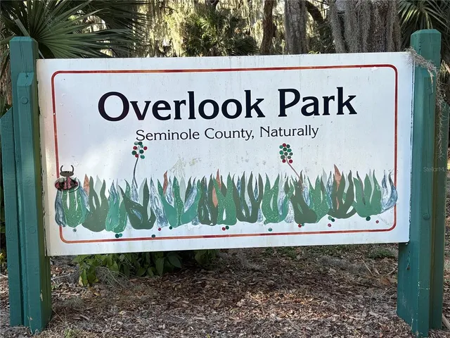 a view of a park with a sign board