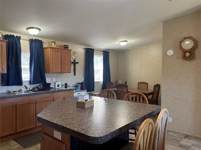 a view of a a dining table and chairs