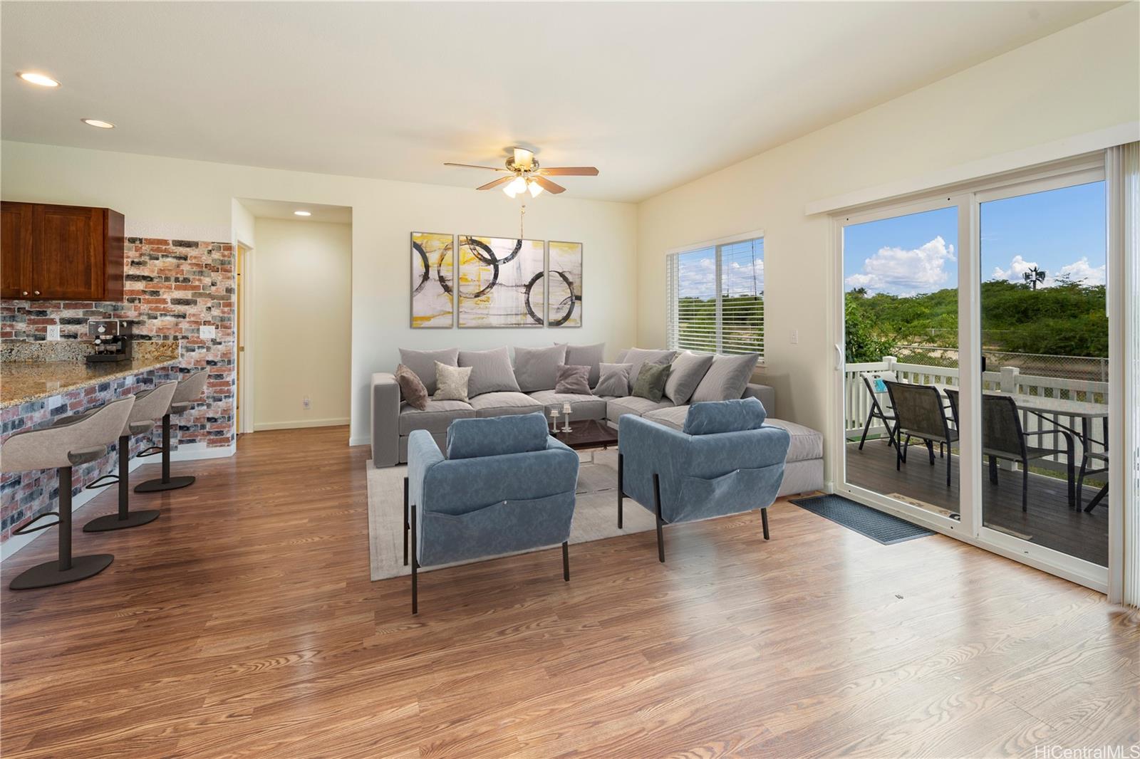 87-176 Maipalaoa Road, Unit MN31 Waianae, HI 96792 - Photo 1 of 1 a living room with furniture and a wooden floor