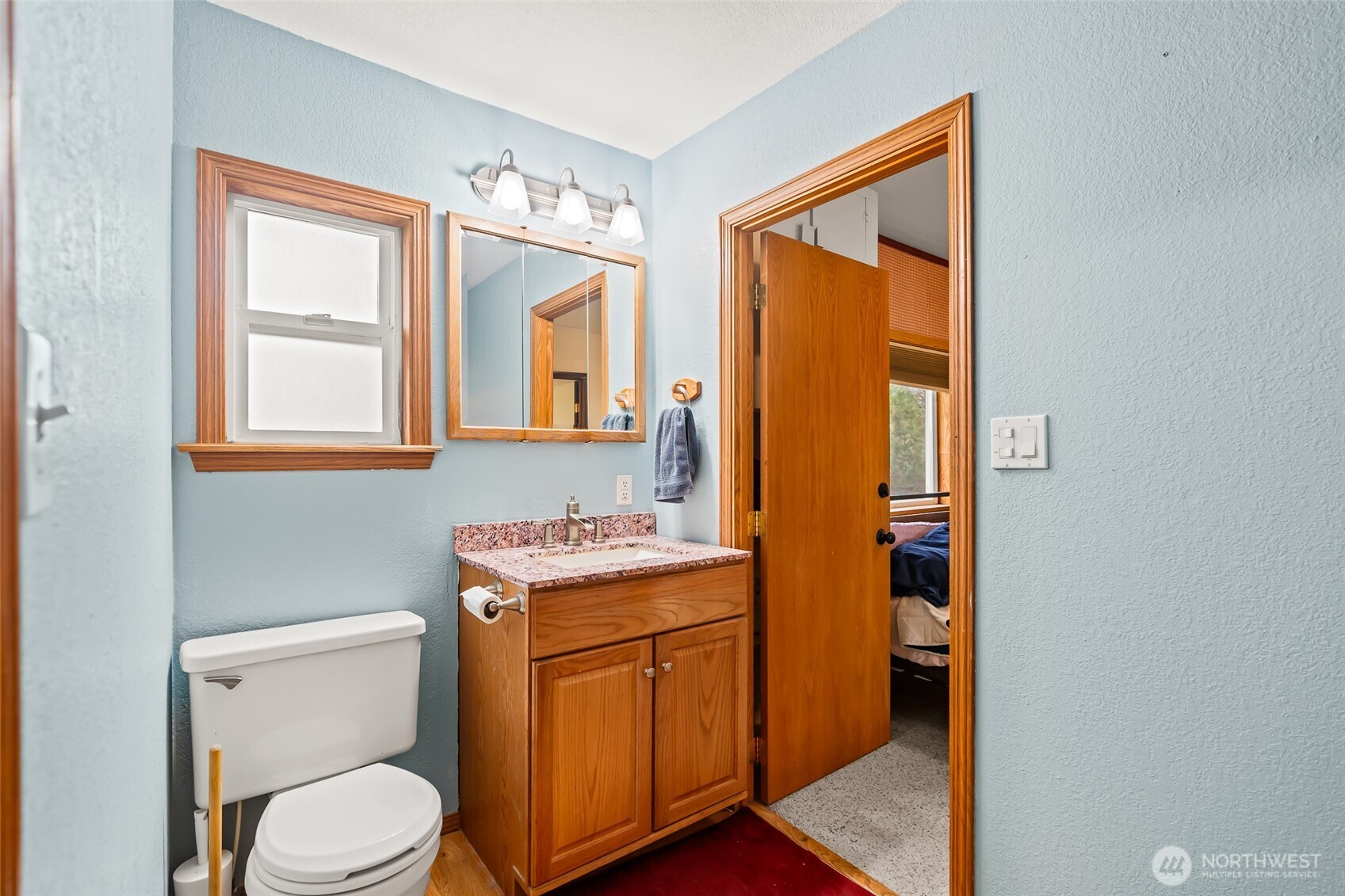 750 Potter Road Tieton, WA 98947 - Photo 16 of 36 a bathroom with a toilet sink and mirror