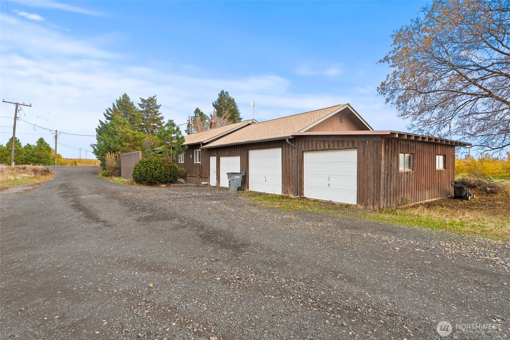 750 Potter Road Tieton, WA 98947 - Photo 2 of 36 a front view of a house with a yard and garage