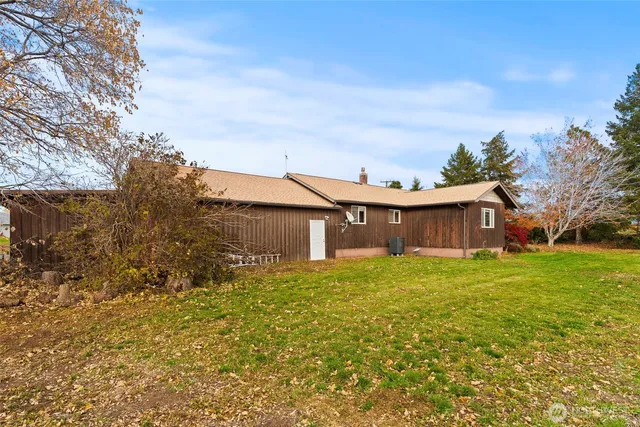 a view of outdoor space with playground and green space