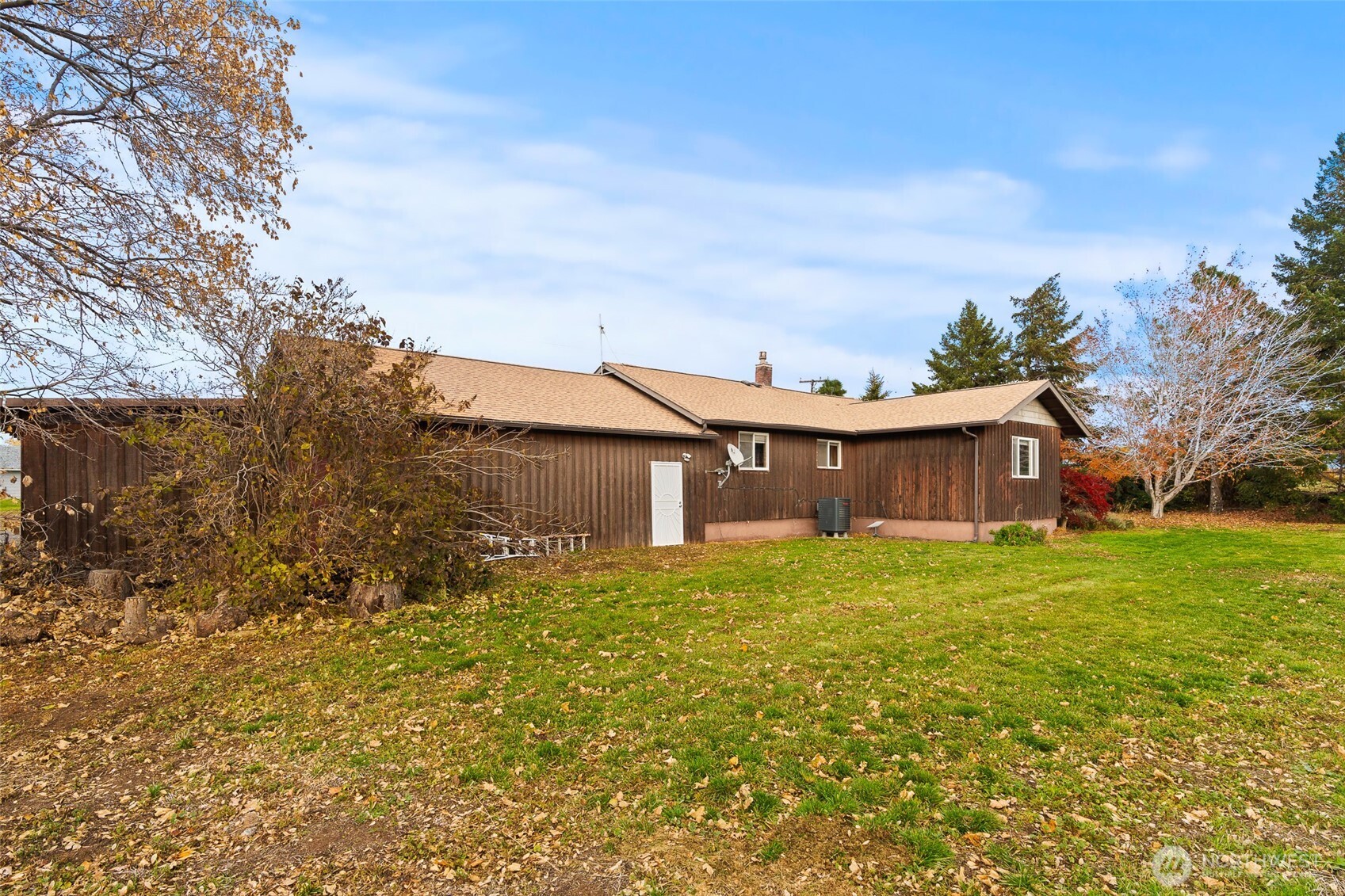 750 Potter Road Tieton, WA 98947 - Photo 26 of 36 a yellow house with trees in front of it
