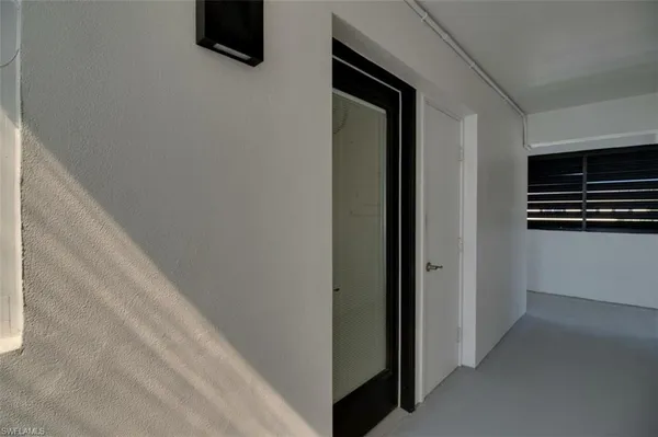 a view of a kitchen from an empty room