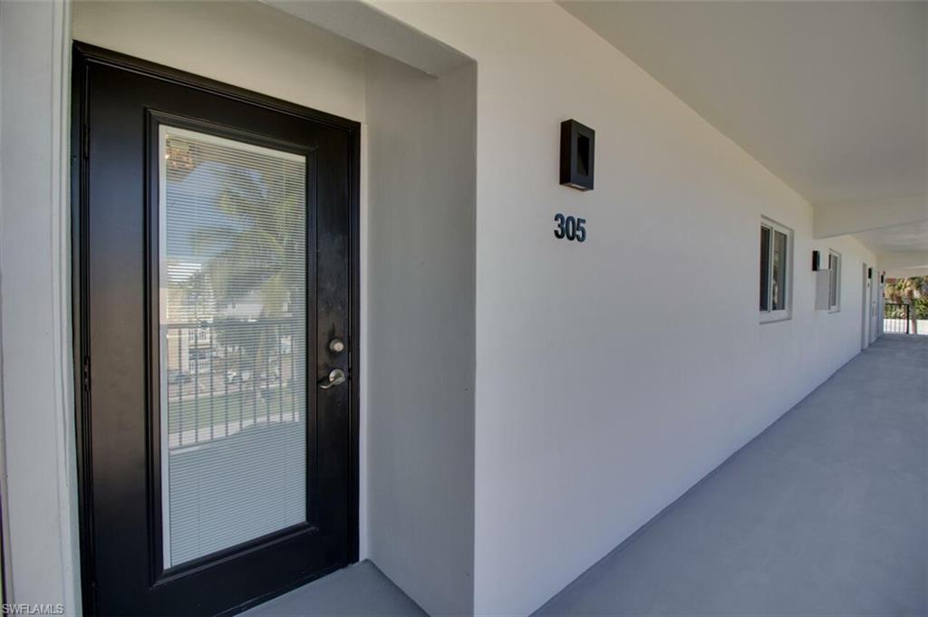 250 7th Avenue South, Unit 305 Naples, FL 34102 - Photo 22 of 24 a bathroom with a shower