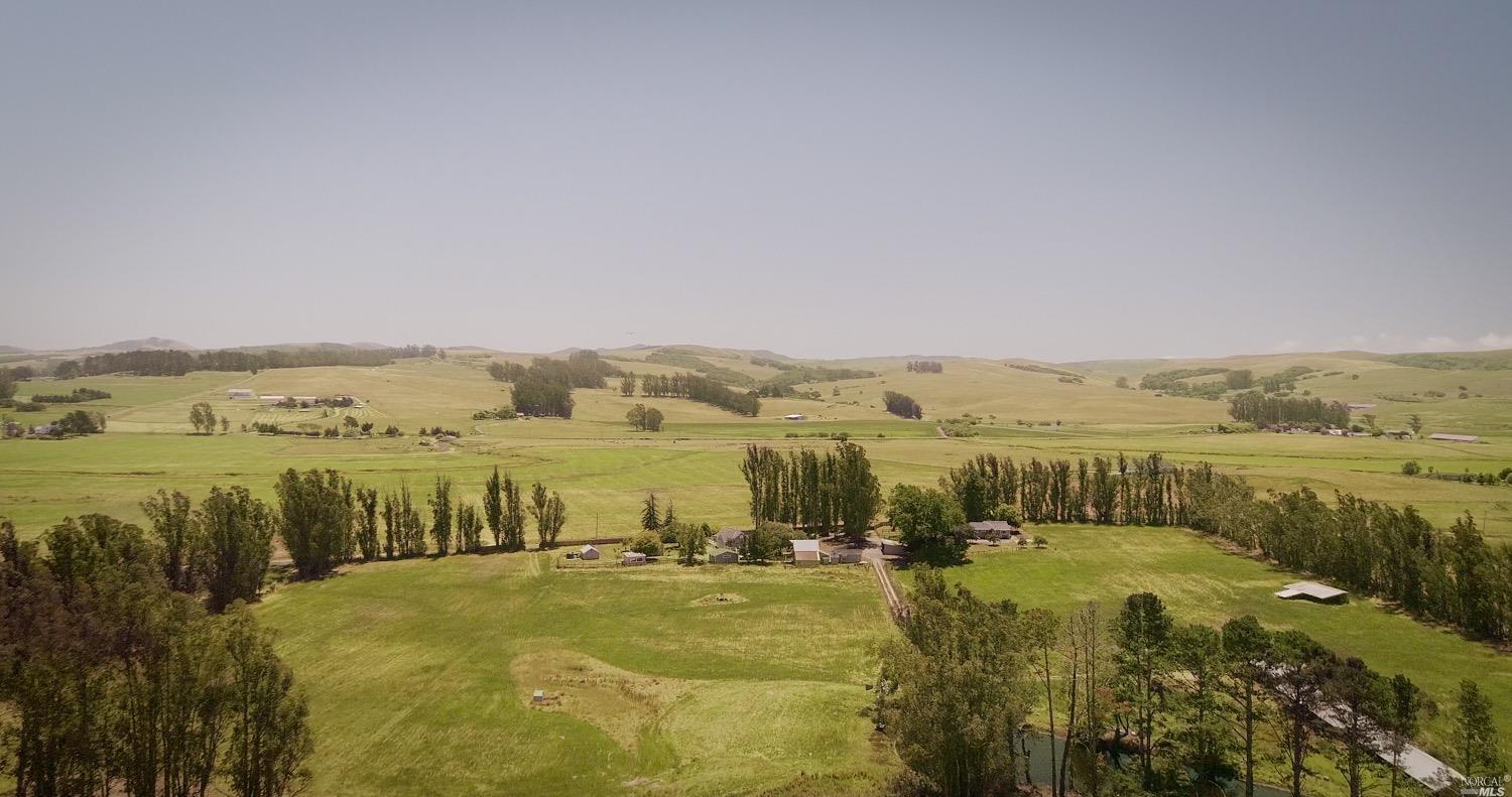 a view of a lake with houses in the back