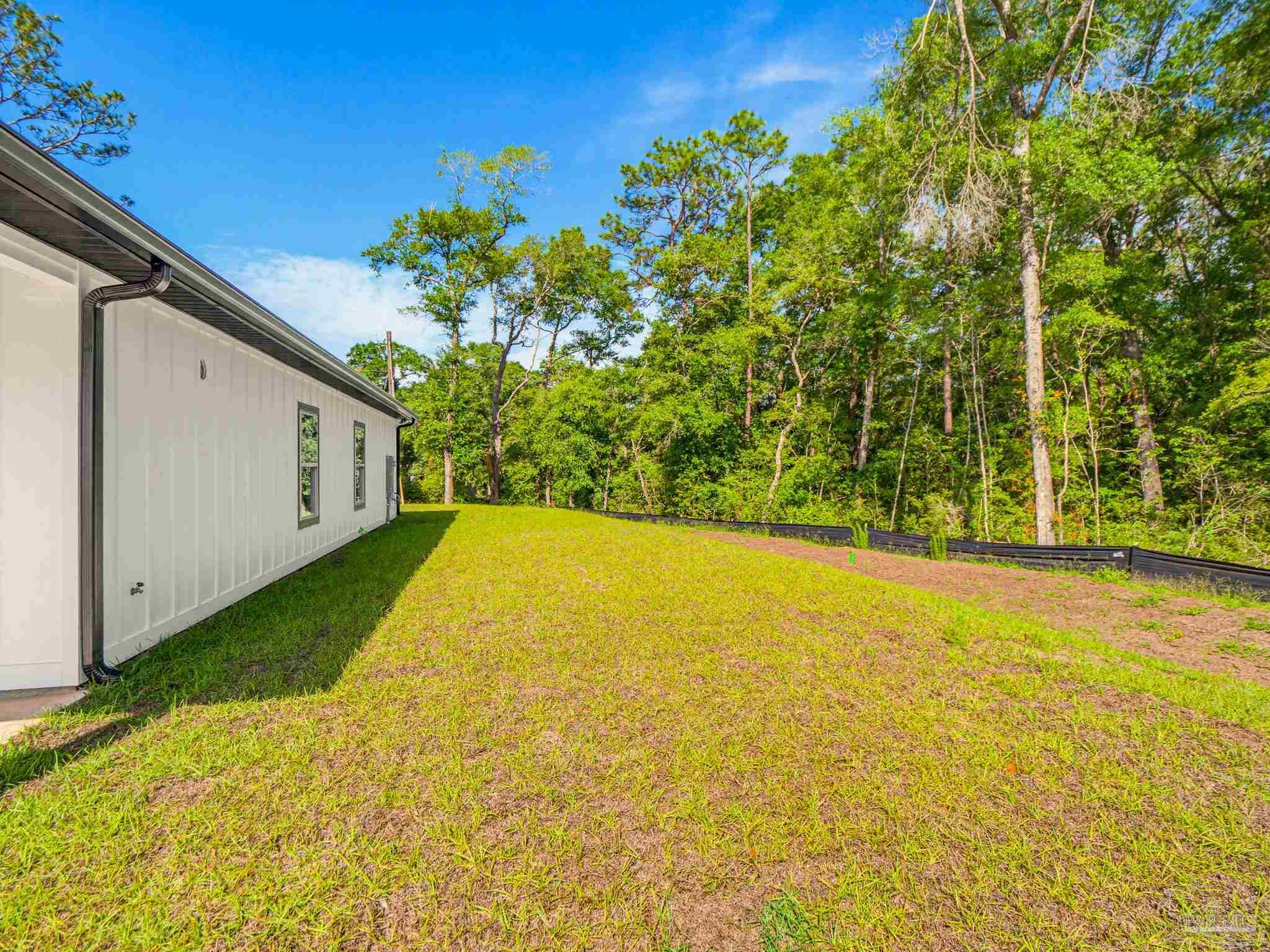 5724 Riviera Drive Milton, FL 32583 - Photo 51 of 52 a view of back yard of the house