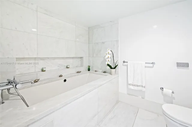 a view of bathroom with bathtub sink and toilet