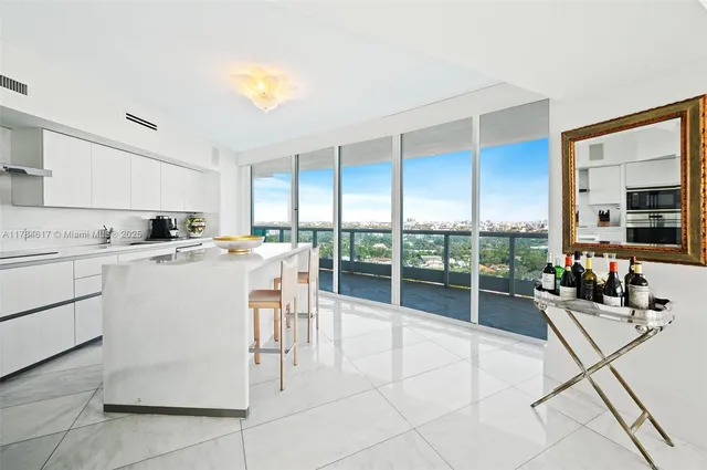a work place with glass top table and chairs