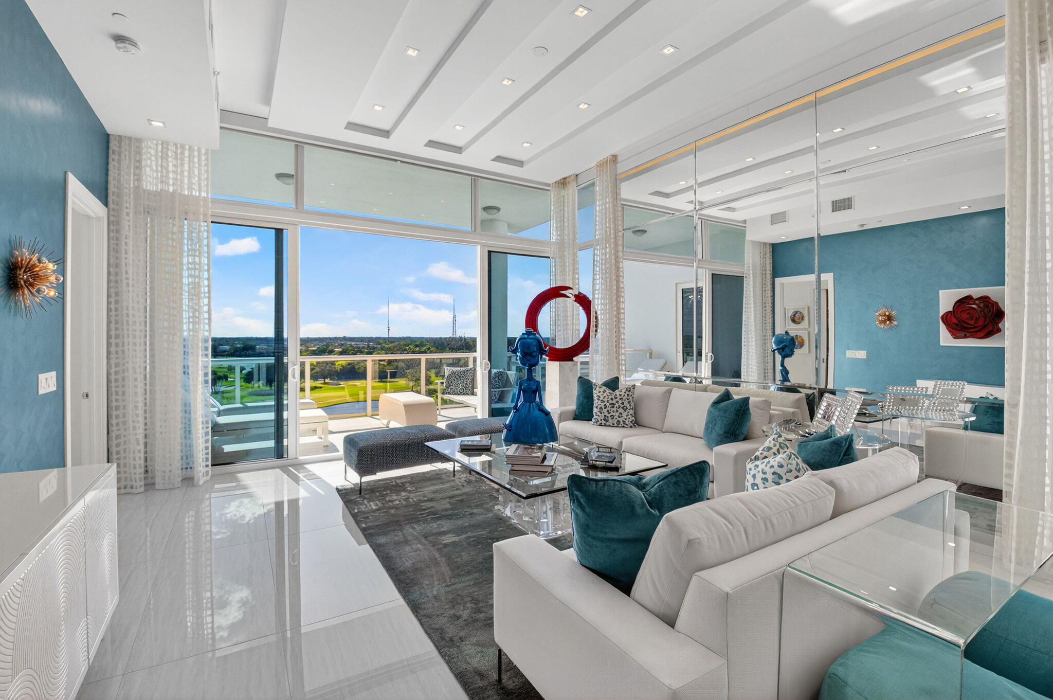 20155 Boca W Drive, Unit PHB904 Boca Raton, FL 33434 - Photo 3 of 50 a living room with fireplace furniture and a large window