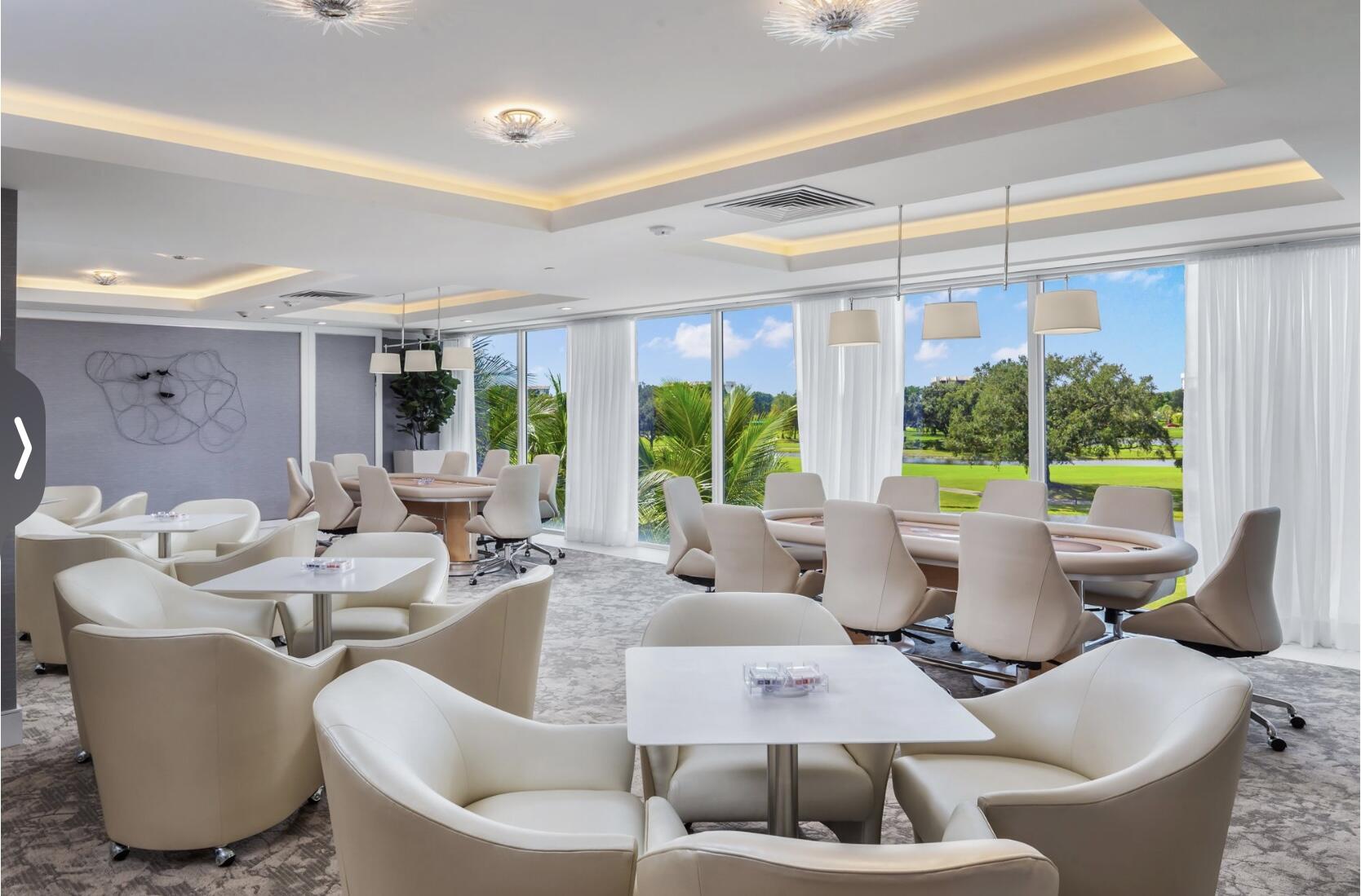 20155 Boca W Drive, Unit PHB904 Boca Raton, FL 33434 - Photo 37 of 50 a living room with furniture and a large window