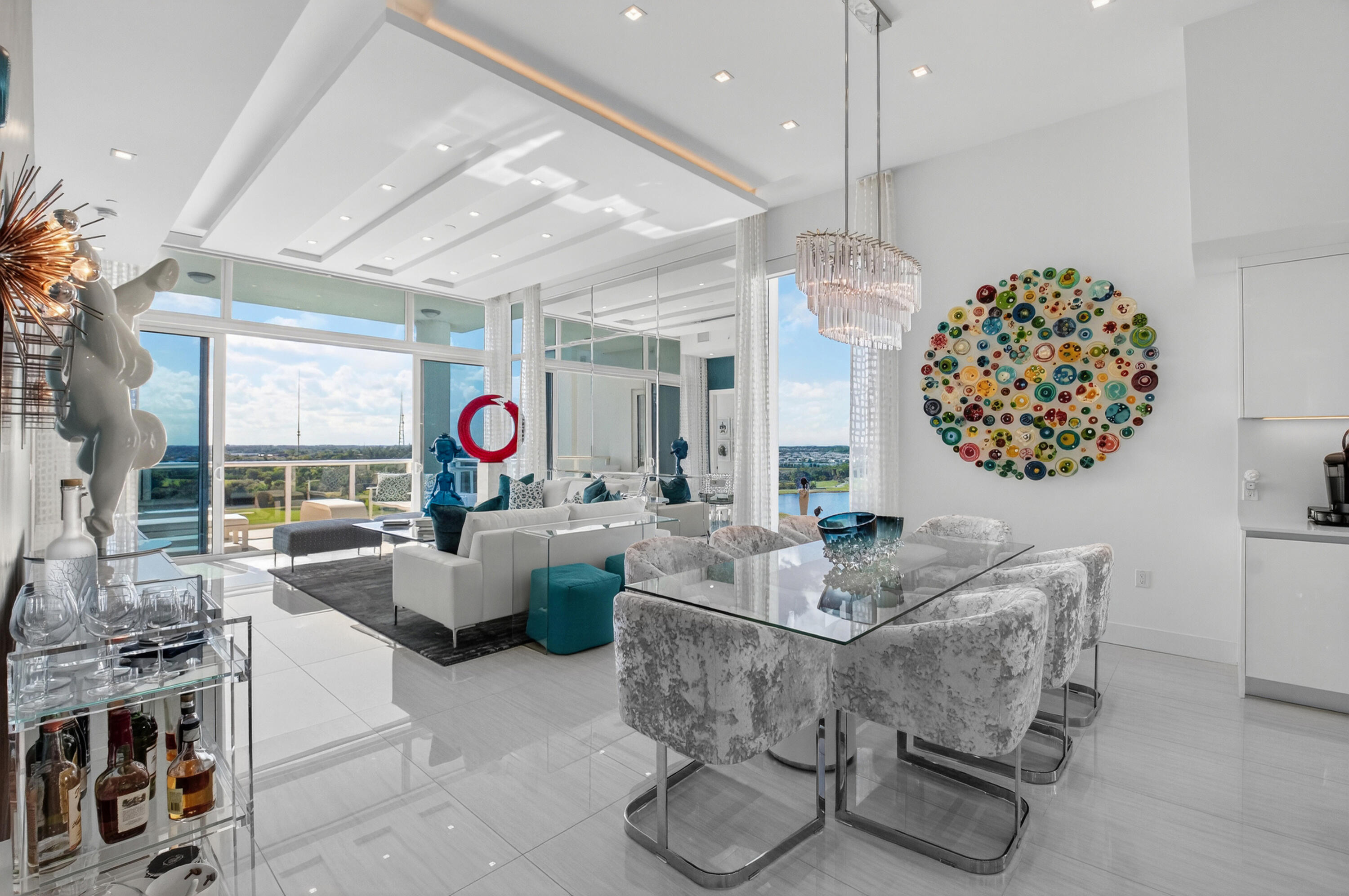 20155 Boca W Drive, Unit PHB904 Boca Raton, FL 33434 - Photo 6 of 50 a living room with furniture and a chandelier