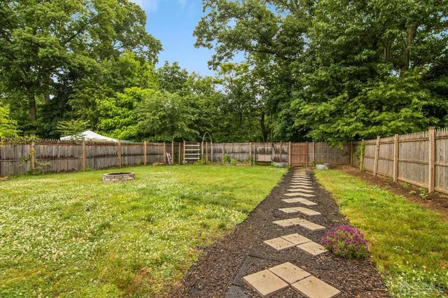a view of a yard with a small trees