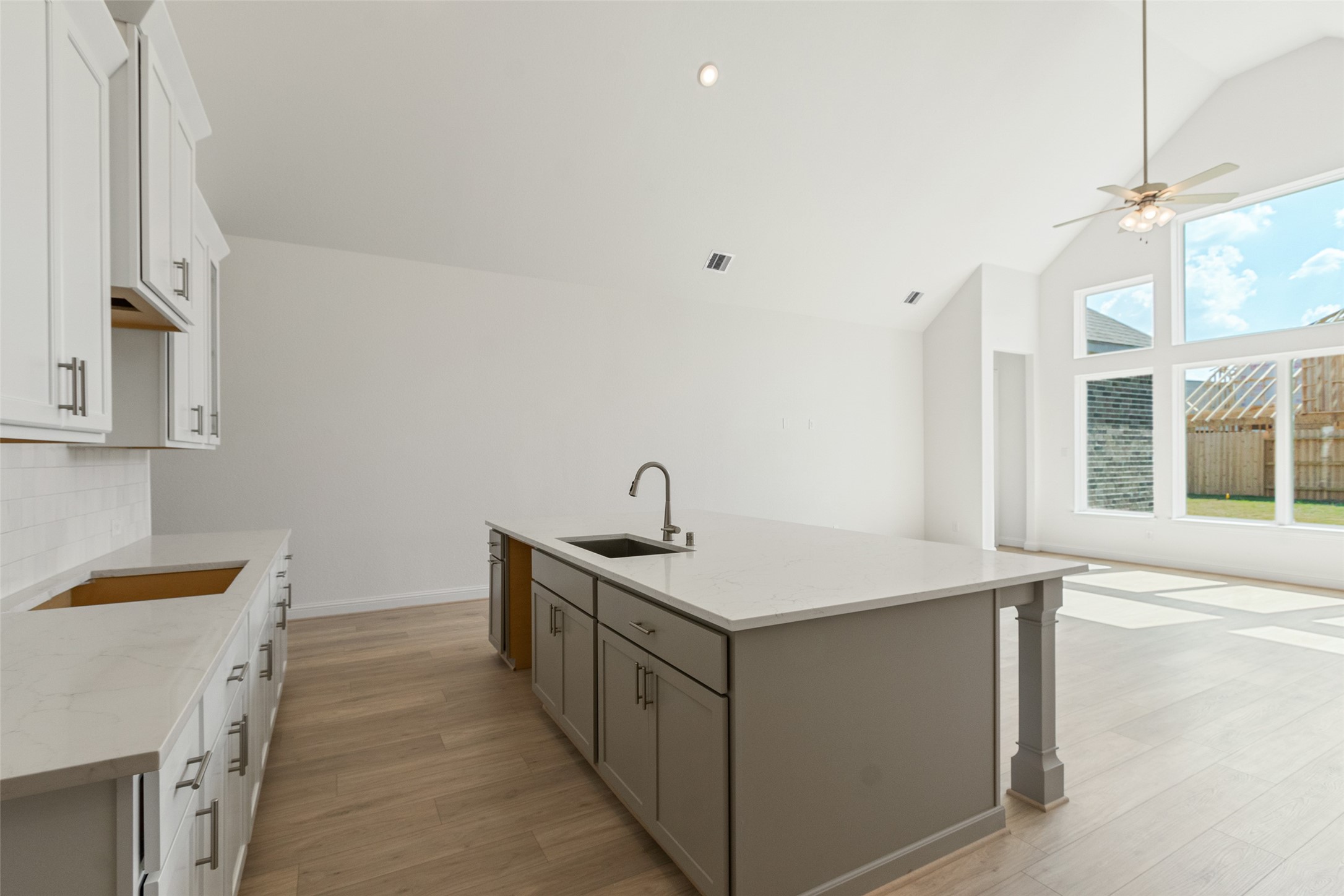 338 Blue River Trail Rosenberg, TX 77471 - Photo 11 of 36 a room with a sink dishwasher and a stove with wooden floor