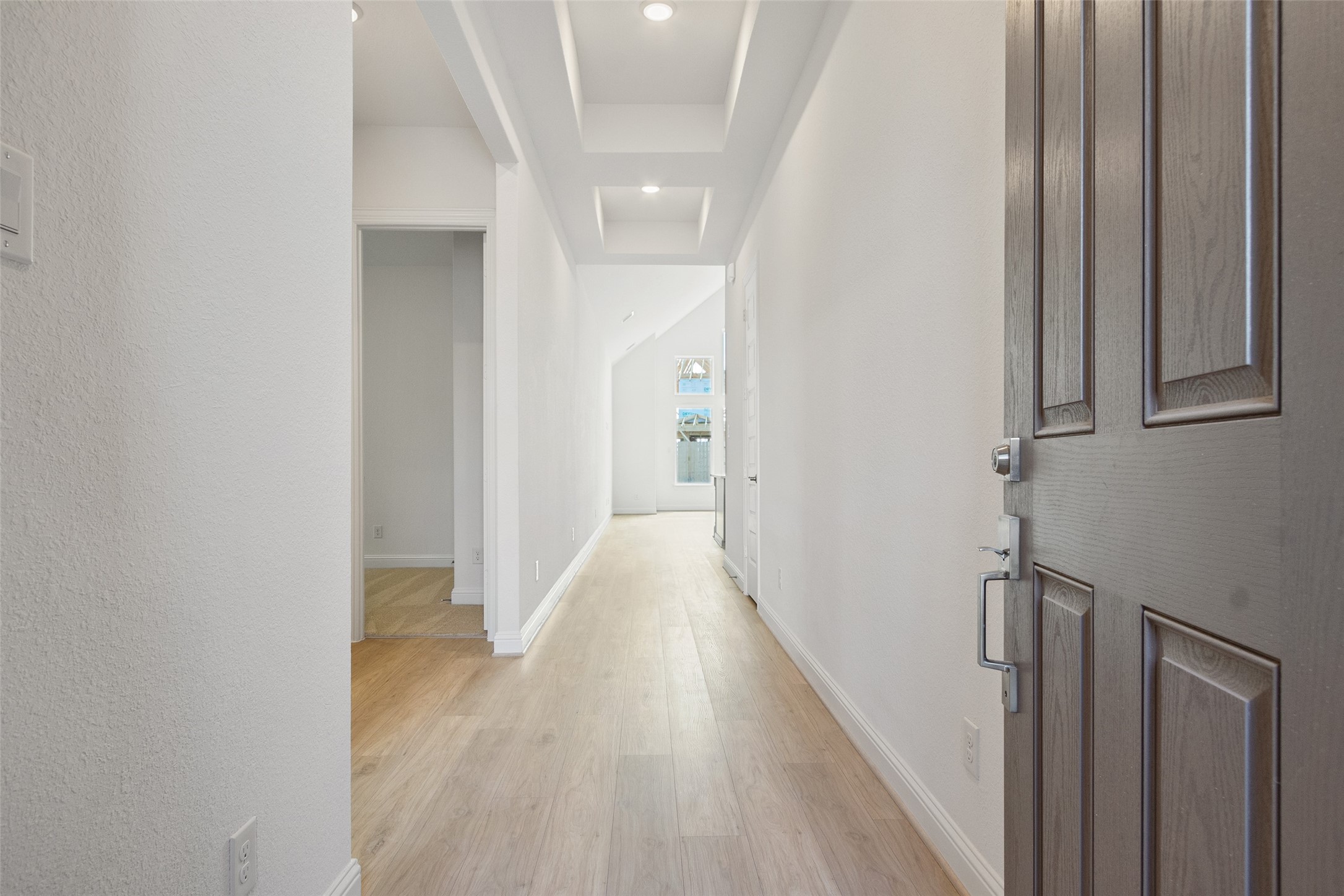 338 Blue River Trail Rosenberg, TX 77471 - Photo 5 of 36 a view of a hallway with wooden floor