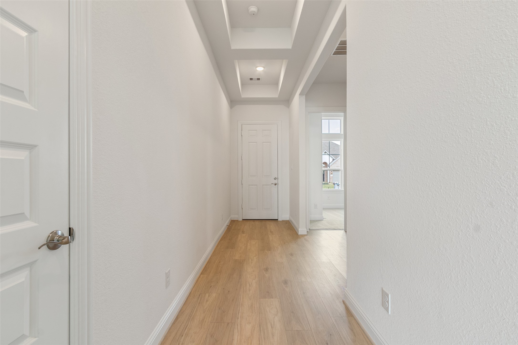 338 Blue River Trail Rosenberg, TX 77471 - Photo 6 of 36 a view of a hallway with wooden floor