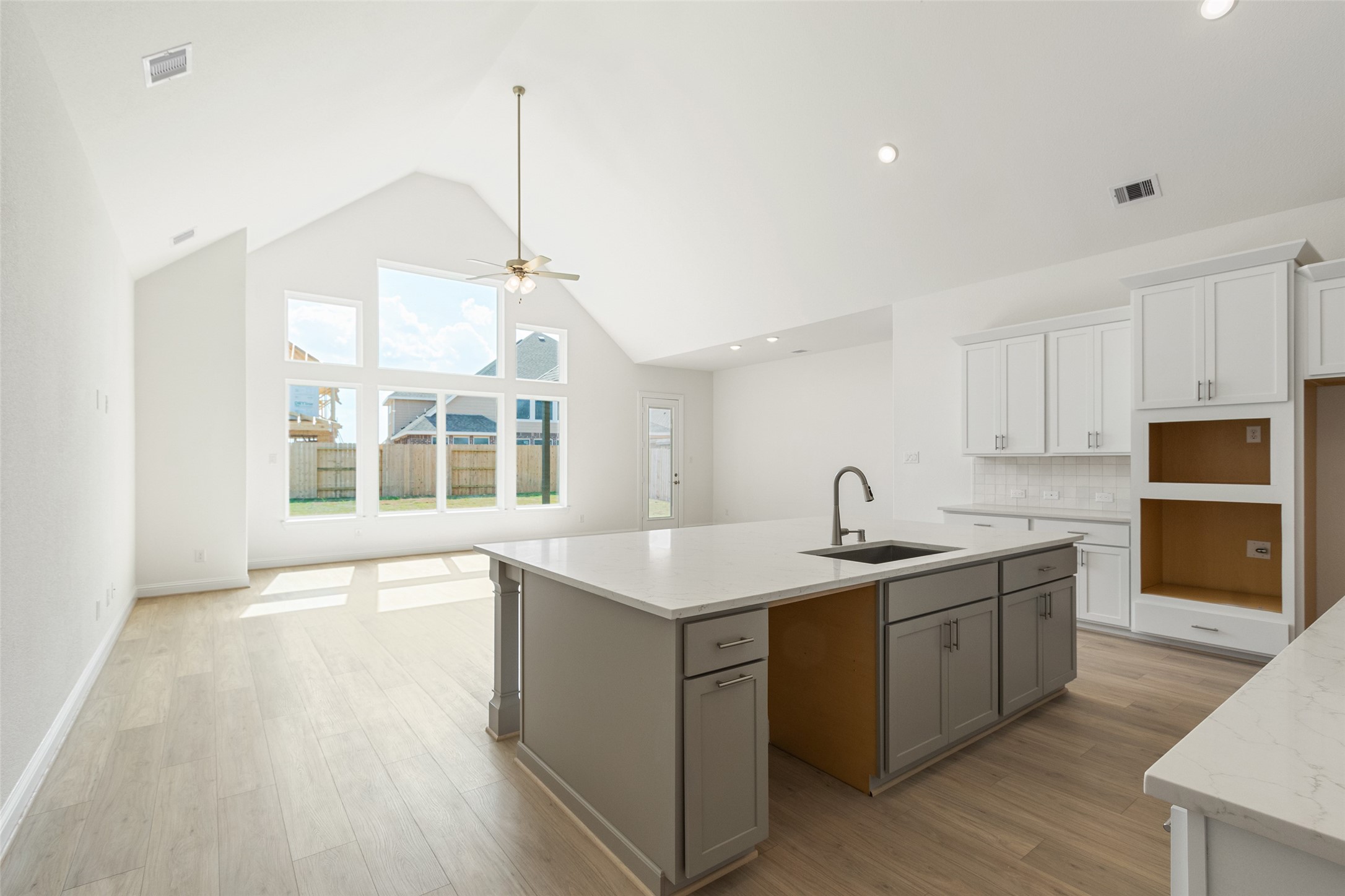 338 Blue River Trail Rosenberg, TX 77471 - Photo 7 of 36 a kitchen with a sink stove and cabinets