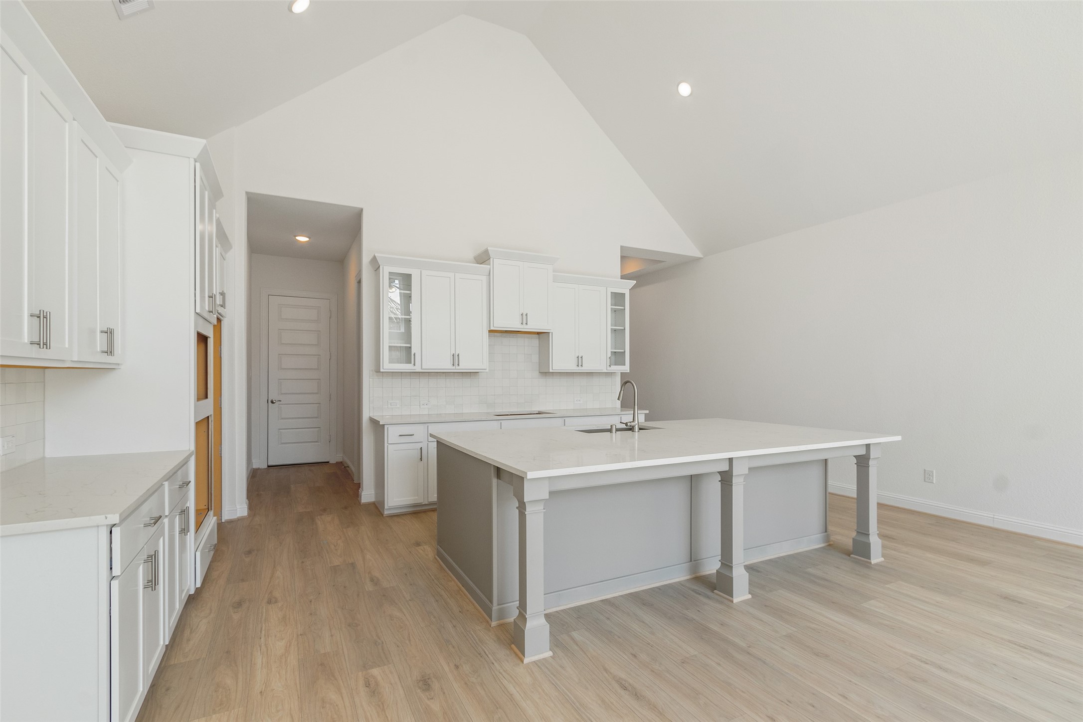 338 Blue River Trail Rosenberg, TX 77471 - Photo 10 of 36 a kitchen with a sink stove and cabinets