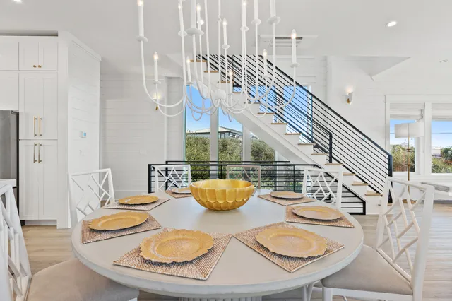 a view of a balcony with furniture and wooden floor