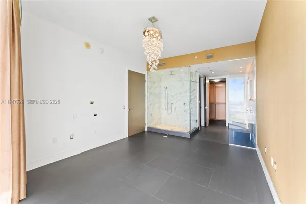 a bathroom with a bathtub and a shower