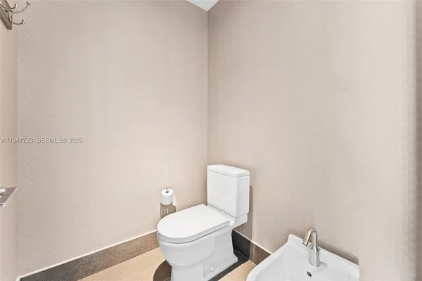 an empty room with a bathroom