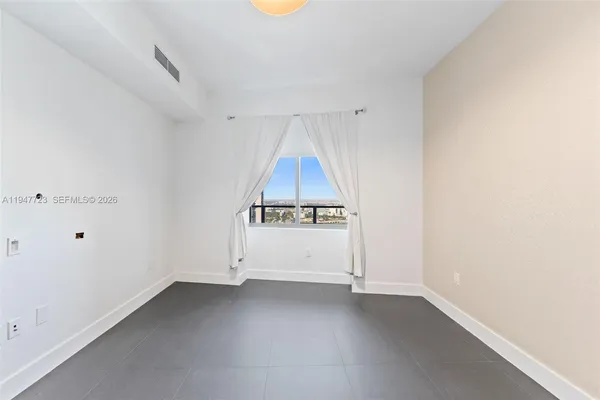 a view of walk in closet with wooden floor