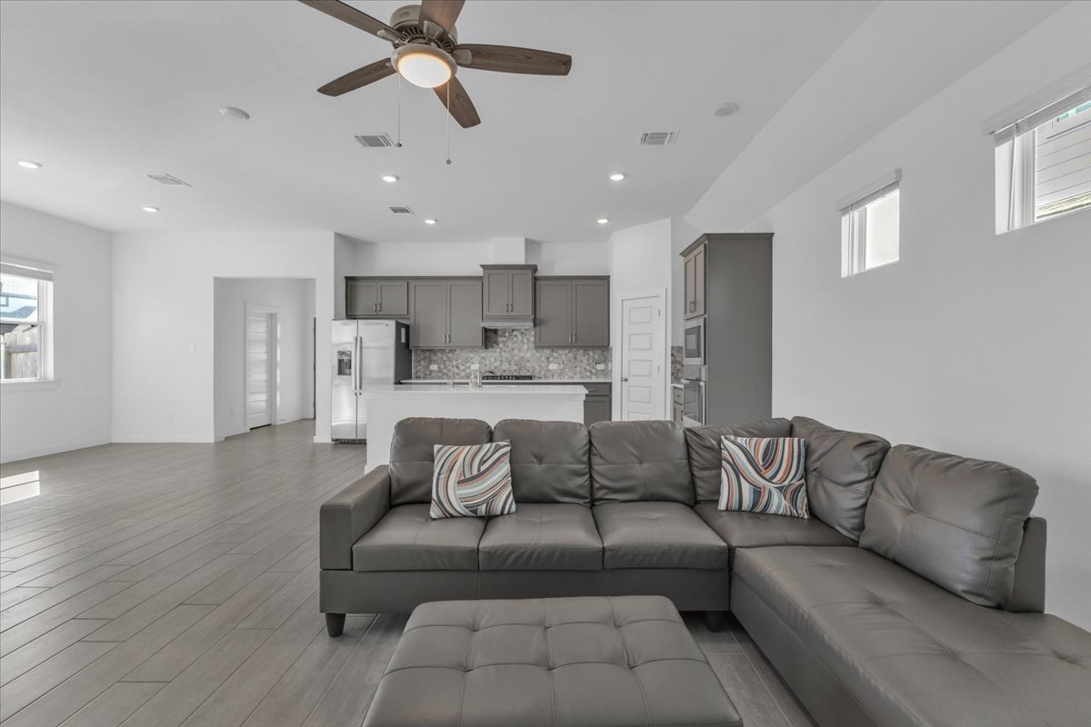 12620 Penguin Path Manor Manor, TX 78653 - Photo 16 of 37 Living area featuring healthy amount of natural light, ceiling fan, light wood finished floors, and recessed lighting