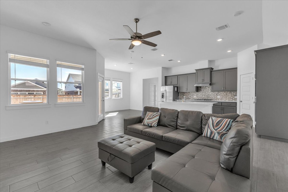 12620 Penguin Path Manor Manor, TX 78653 - Photo 17 of 37 Living room featuring a ceiling fan, light wood finished floors, and recessed lighting