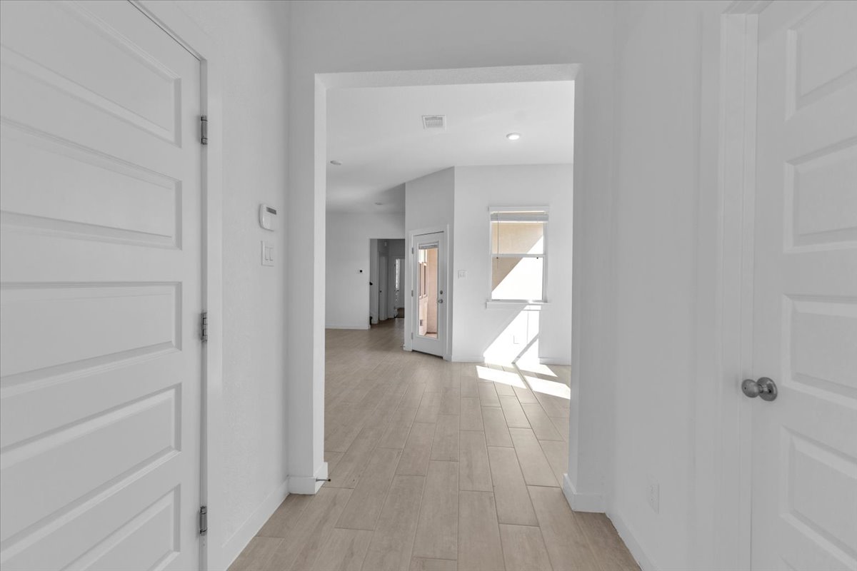 12620 Penguin Path Manor Manor, TX 78653 - Photo 7 of 37 Corridor featuring light wood-style flooring and recessed lighting