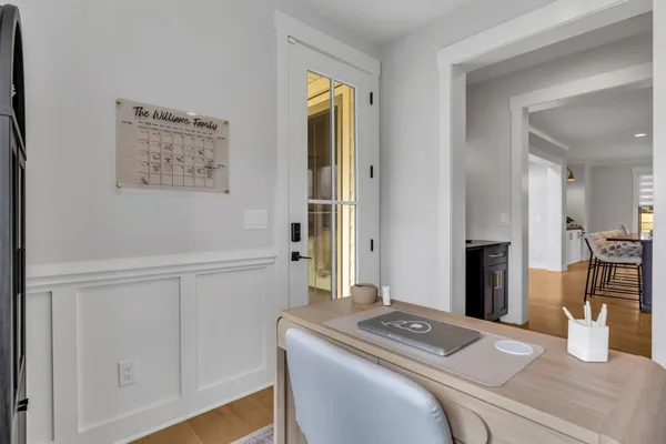 a bedroom with a bed and a lamp